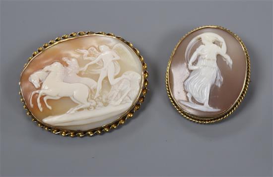 Two yellow metal mounted oval cameo brooches, largest 55mm.